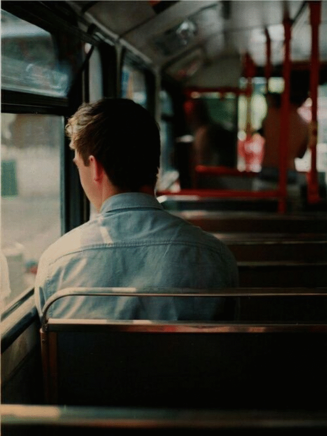 Man sitting alone on bus
