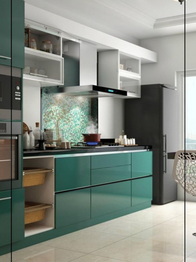 Modern modular kitchen with green cabinets and mosaic backsplash.