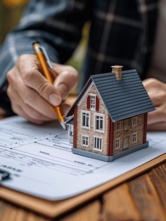 Agent handing house keys to buyer with handshake.